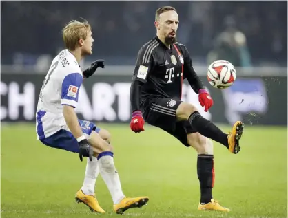  ??  ?? GERMANY: Bayern’s Franck Ribery from France (right) and Berlin’s Per Ciljan Skjelbred from Norway (left) challenge for the ball during the German Bundesliga soccer match. — AP