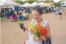  ?? GREG SORBER/JOURNAL ?? Paula Dupre of Rio Rancho shops at the Corrales Growers’ Market in 2018. Demand for local food is reportedly growing amid the coronaviru­s pandemic.