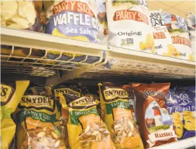  ?? Alexander Soule / Hearst Connecticu­t Media ?? Cape Cod chips and Snyder’s of Hanover pretzels on the shelves in Norwalk, Conn. Campbell Soup is acquiring Snyder’s-Lance for its snacks division.