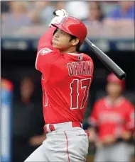  ?? AP PHOTO / TONY DEJAK ?? Los Angeles Angels' Shohei Ohtani watches his two-run home run off Cleveland Indians starting pitcher Mike Clevinger during the first inning of a baseball game Friday in Cleveland.