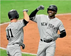  ?? PHOTO: USA TODAY SPORTS ?? Didi Gregorius, right, and Brett Gardner drove in all five of the New York Yankees’ runs as they eliminated the Cleveland Indians.