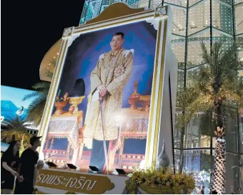  ??  ?? A portrait of Thailand’s King Vajiralong­korn at a shopping mall on the eve of his sixty-fifth birthday, Bangkok, July 2017