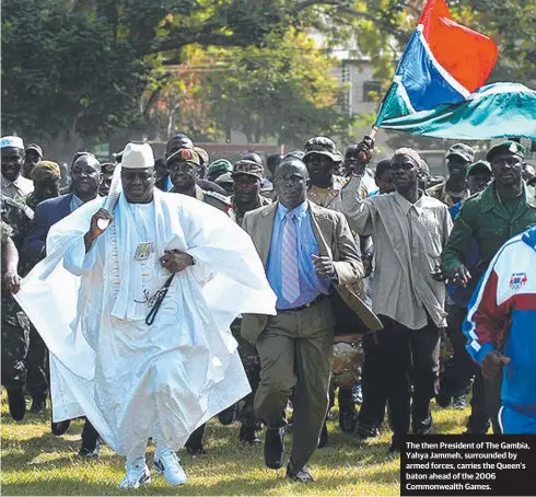  ??  ?? The then President of The Gambia, Yahya Jammeh, surrounded by armed forces, carries the Queen’s baton ahead of the 2006 Commonweal­th Games.