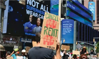  ?? Photograph: Angela Weiss/AFP/Getty Images ?? Protesters rally demanding economic relief during the coronaviru­s pandemic, at Time Square on 5 August 2020 in New York City.