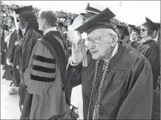  ?? AP PHOTO ?? In this May 5, 2018, photo, World War II veteran Bob Barger salutes during the national anthem at the commenceme­nt ceremony at the University of Toledo, in Toledo, Ohio. Barger, a World War II veteran from Ohio who received his college degree last spring nearly 70 years after he last sat in a classroom, died Wednesday, Newcomer Funeral Home in Toledo said. He was 97.