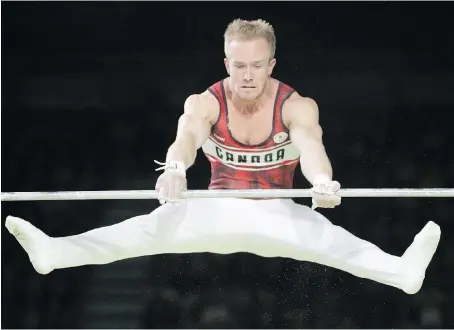  ?? RYAN REMIORZ/THE CANADIAN PRESS ?? Cory Paterson of Montreal shows off his silver medal-winning form in the horizontal bar final in artistic gymnastics at the Commonweal­th Games Monday in Coomera, Australia. Canada’s gymnasts have combined for 11 medals at the Gold Coast Games.