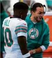  ?? DOUG MURRAY/ASSOCIATED PRESS ?? Coach Mike McDaniel enjoyed himself as Tyreek Hill (8 catches, 112 yards, TD) and the Dolphins rolled.