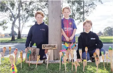  ??  ?? Creating positivity and bringing people together is the Wilson family, (from left) Van, Nyah and Jude with the “Spoonville” community in Longwarry. What started with five to six spoony people from the Wilson family has grown to more than 40.