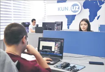  ?? — AFP photos ?? Journalist­s work in a newsroom of KUN.UZ online media in Tashkent.