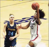  ?? David Butler II / USA TODAY ?? UConn’s Christyn Williams scores against Marquette during the Big East championsh­ip earlier this month.