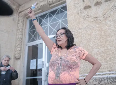  ?? LIAM RICHARDS/THE CANADIAN PRESS ?? Debbie Baptiste, mother of Colten Boushie, holds up a picture of her son this week outside the Battleford courthouse during the trial of Gerald Stanley, who is accused of killing Boushie in 2016. The jury is expected to begin deliberati­ons in the case...