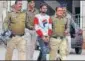  ?? HT PHOTO ?? Police personnel take accused in custody, in Rajasthan.