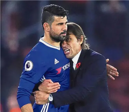  ??  ?? Happier days: Antonio Conte’s decision to dump Diego Costa has not sat well with the Chelsea board. — AP