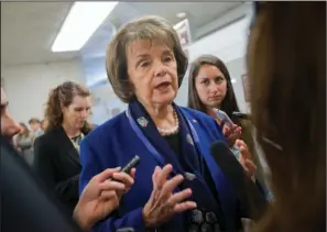  ??  ?? TERROR LIST: Sen. Dianne Feinstein, D-Calif., speaks with reporters June 2 on Capitol Hill in Washington. People on the U.S. government’s terrorist watch list can’t board commercial airliners, but they can walk into a gun store and legally buy pistols...