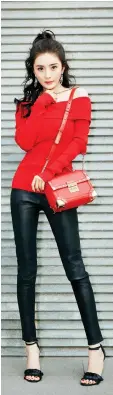  ??  ?? Chinese actress Yang Mi is an ambassador for Michael Kors. Mi wears the Michael Michael Kors Cori Small Leather Crossbody, $ 448