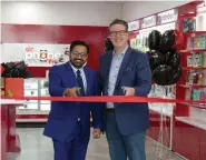  ?? SUPPLIED ?? Piyush Sawhney, CEO of Dr. Phone Fix, (left) and Saskatoon Chamber of Commerce CEO Jason Aebig (right) recently celebrated the grand opening of Saskatoon’s two new Dr. Phone Fix stores with a ribbon cutting ceremony.