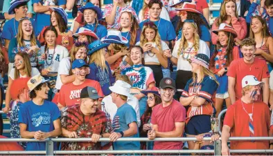  ?? APRIL GAMIZ/THE MORNING CALL ?? Palmerton fans enjoy the evening decked out in patriotic colors Friday as the Blue Bombers hosted the Catasauqua Rough Riders.