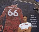  ??  ?? In front of his Anfield mural