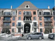  ??  ?? The brick facade of the condo complex echoes the Paris landmark by which it was inspired, though in a more modest manner.