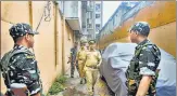  ?? PTI ?? Security personnel during NIA raid at the residence of Dawood Ibrahim's associate Salim Fruit in Mumbai on Monday.