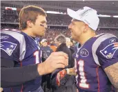  ?? ELISE AMENDOLA/ASSOCIATED PRESS ?? New England’s Tom Brady and Aaron Hernandez congratula­te each other after their 2012 AFC Championsh­ip win over Baltimore. Hernandez had signed a 5-year, $40 million contract but threw it all away.
