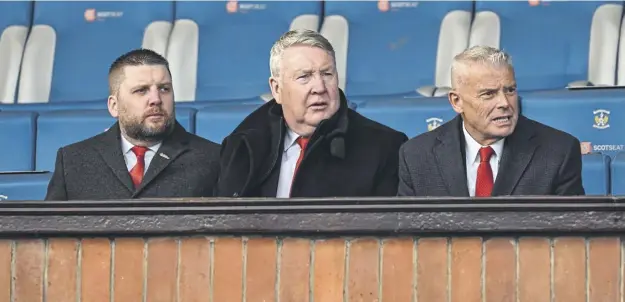  ?? ?? From left to right, Aberdeen CEO Alan Burrows, director Willie Garner and chairman Dave Cormack look on during last month’s league match at Kilmarnock