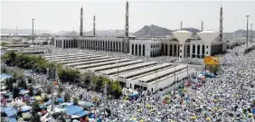  ??  ?? Hundreds of thousands of Muslim pilgrims pray Sunday outside Namira Mosque in Arafat, on the second and most significan­t day of the annual hajj pilgrimage, near the holy city of Mecca, Saudi Arabia.
