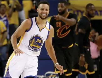  ?? EZRA SHAW, GETTY IMAGES ?? Stephen Curry sports a big smile as his Golden State Warriors cruised to a 2-0 series lead over Cleveland on Sunday night in the best-of-seven NBA finals. The Warriors beat the Cavaliers, 132-113.