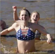  ?? FRAN MAYE — MEDIANEWS GROUP ?? Facial expression­s tell the story of how cold the water was Saturday morning during the 11th annual Polar Plunge.