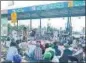  ?? ?? Farmers block Dhareri Jattan Toll Plaza on the Chandigarh­bathinda Highway.