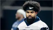  ?? AP File Photo ?? Dallas Cowboys running back Ezekiel Elliott walks off the field May 22 after NFL football practice in Frisco, Texas.