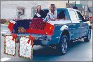  ?? (Courtesy Photo/Mallory Weaver) ?? Miss Gravette Kinsley Hurtt and Miss Teen Gravette Hayle Vestal ride together in the Gravette Christmas parade. The girls, crowned on Gravette Day in August, were joined by several other members of area royalty.