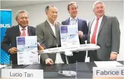  ??  ?? Airbus President and Chief Executive Officer (CEO) Fabrice Bregier (2nd from right) poses with Philippine Airlines President and COO Jaime Bautista (left) PAL Chairman Lucio Tan (2nd from left), and Airbus Chief Operating Officer Customers John Leahy after a signing ceremony at the Singapore Airshow at Changi Exhibition Center February 17, 2016. (Reuters)