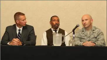  ?? The Sentinel-Record/Richard Rasmussen ?? HANDLING CRISIS: From left, Under Sheriff Jason Lawrence, of the Garland County Sheriff’s Department, and Boyce Mitchell, of Ouachita Behavioral Health and Wellness, listen as Little Rock Air Force Base Capt. Scotty Howard talks during a panel discussion titled “Responding to Crisis” at the Moving Forward: Suicide Prevention Conference 2018 at the Arlington Resort Hotel &amp; Spa Thursday.