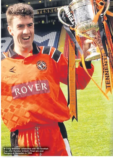  ??  ?? ■ Craig Brewster celebrates with the Scottish Cup after Dundee United’s Final win over Rangers at Hampden in 1994.