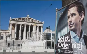  ?? (Reuters) ?? AN ELECTION campaign poster shows Sebastian Kurz of the People’s Party opposite the Austrian parliament building in Vienna on Sunday.