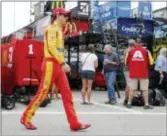  ?? THE ASSOCIATED PRESS ?? Joey Logano walks to his car in the garage at the start of practice for the NASCAR Cup Series auto race Saturday at New Hampshire Motor Speedway.
