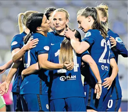  ??  ?? Advantage: Pernille Harder (centre) celebrates with her team-mates after scoring Chelsea’s second goal against her former club Wolfsburg