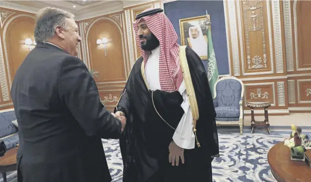  ?? PICTURE; AFP/GETTY IMAGES ?? 0 US Secretary of State Mike Pompeo , left, shakes hands with Saudi Crown Prince Mohammed bin Salman in Riyadh yesterday