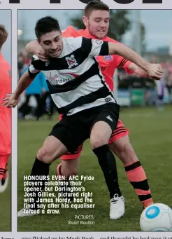  ?? PICTURES: Stuart Boulton ?? HONOURS EVEN: AFC Fylde players celebrate their opener, but Darlington’s Josh Gillies, pictured right with James Hardy, had the final say after his equaliser forced a draw.