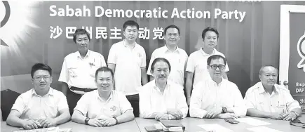  ??  ?? Wong (seated middle), Chan (second from left), Frankie (second from right) and DAP Sabah leaders during the press conference.