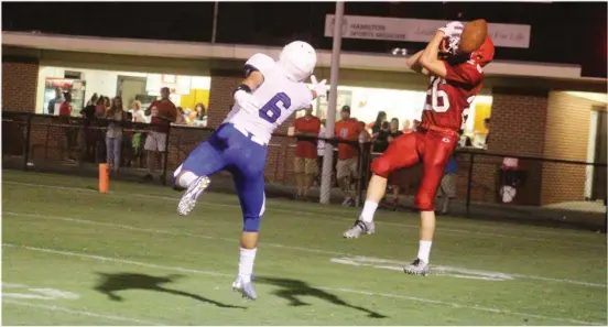  ??  ?? Grant Goldberg of Dalton tries to intercept a pass intended for Mac Brower of Ringgold on Friday at Bill Harmon Field in a scrimmage. (Catoosa News photo/ Misty Martin)