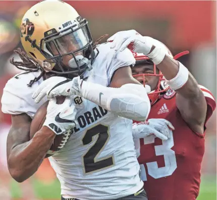  ?? BRUCE THORSON/USA TODAY SPORTS ?? Colorado wide receiver Laviska Shenault Jr. catches a TD pass against Nebraska cornerback DiCaprio Bootle last month.