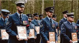  ?? Jan Mazur/Associated Press ?? British soldiers pay tribute to Allied prisoners of war who tunneled out of a German POW camp during World War II on the 80th anniversar­y of the escape, in Zagan, Poland on Sunday. The ingenious act of defiance has come to be known as the “Great Escape.” Only three made it to safety.