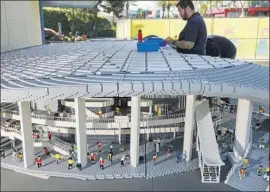  ?? Legoland ?? THE ROOF of the SoFi Stadium replica, constructe­d from 3,500 pounds of Lego bricks, is considered “the structure’s most notable feature,” Legoland says.