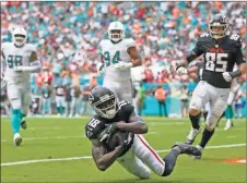  ?? Sam navarro/usa Today sports ?? Atlanta Falcons wide receiver Calvin Ridley (18) makes a catch in the end zone for a touchdown against the Miami Dolphins during the second quarter of the game at Hard Rock Stadium.