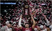  ?? ASHLEY LANDIS — THE ASSOCIATED PRESS ?? Alabama guard Mark Sears holds the winner's trophy after defeating Clemson in an Elite 8 college basketball game in the NCAA tournament Saturday in Los Angeles.