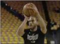  ?? JEFF CHIU — THE ASSOCIATED PRESS ?? San Antonio Spurs forward Kawhi Leonard warms up before Game 1 of the Western Conference finals against the Golden State Warriors in Oakland Sunday.