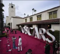  ?? ASSOCIATED PRESS ?? Regina King, left, and Aldis Hodge arrive at the Oscars on Sunday, April 25, 2021, at Union Station in Los Angeles.