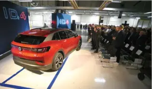  ?? STAFF PHOTO BY MATT HAMILTON ?? Visitors applaud during the 2022 launch celebratio­n for the Volkswagen ID.4 electric SUV at the Chattanoog­a Volkswagen assembly plant.